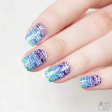 A manicured hand with festival design by Maniology.