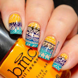  A manicured hand holding a Sunrise stamping polish from Essentials Bright Collection by Maniology.