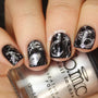 A manicured hand in black with moon, constellation and planets designs