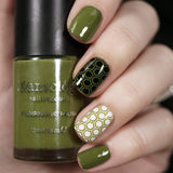 A manicured hand holding olive green stamping polish from Stocking Stuffer Evergreen (B315).