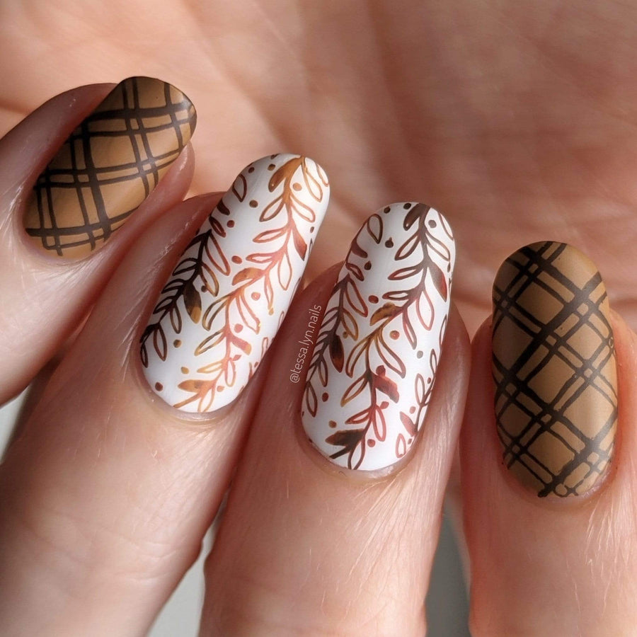 A manicured hand with plaids and leaves design by Maniology (m164).