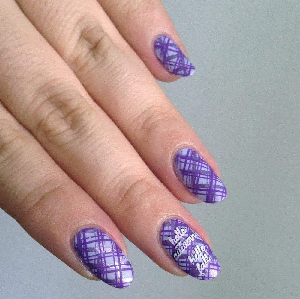 A manicured hand with plaids designs by Maniology (m164).