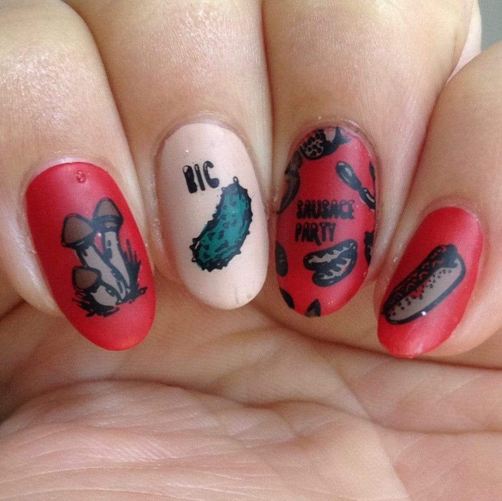 A manicured hand in red with mushrooms and sausage designs.