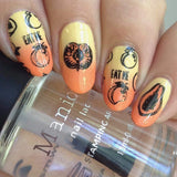 A manicured hand in yellow and orange with different types of fruit designs holding a polish by Maniology.