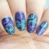 A manicured hand made with icy teal blue Stamping Polish Frosty (B306).