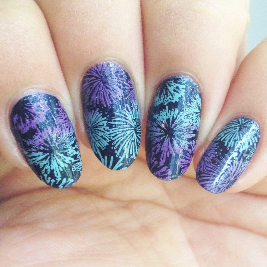 A manicured hand made with icy teal blue Stamping Polish Frosty (B306).