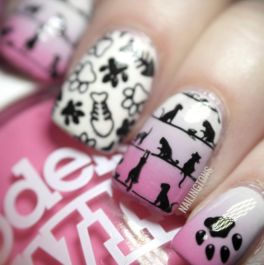 A manicured hand with Cat People/Feline Lover designs by Maniology (m144).