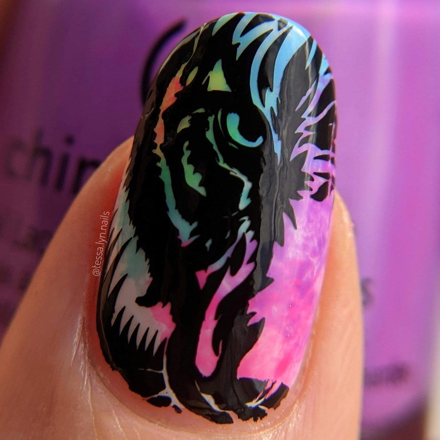 A manicured hand with Wild Eyes/Don't Blink design by Maniology (m135).