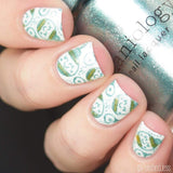  A manicured hand holding Baby Blue Metallic Stamping Polish Chill Out (B264)