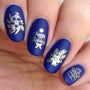 A manicured hand made with blue and metallic gold It's Lit (B262) stamping polish.