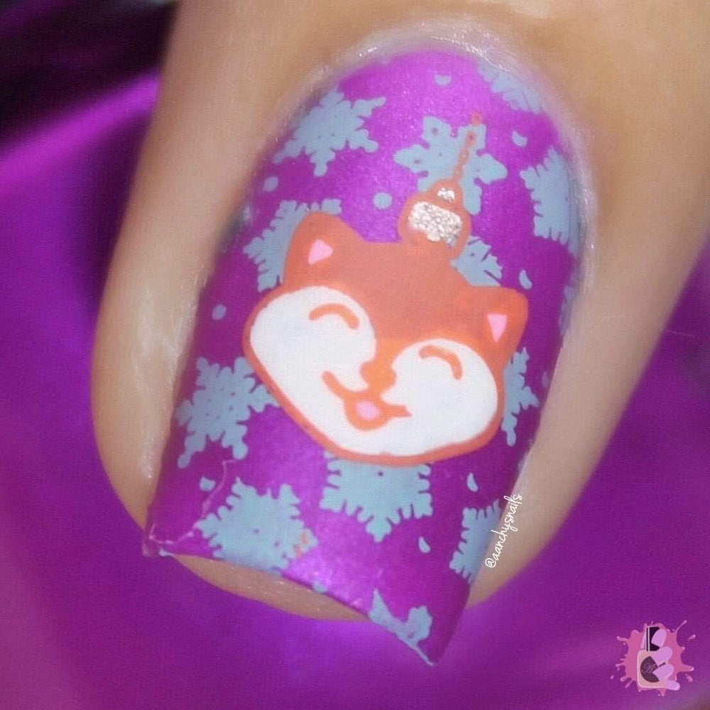 A manicured hand in violet with holiday and animal ornaments design.