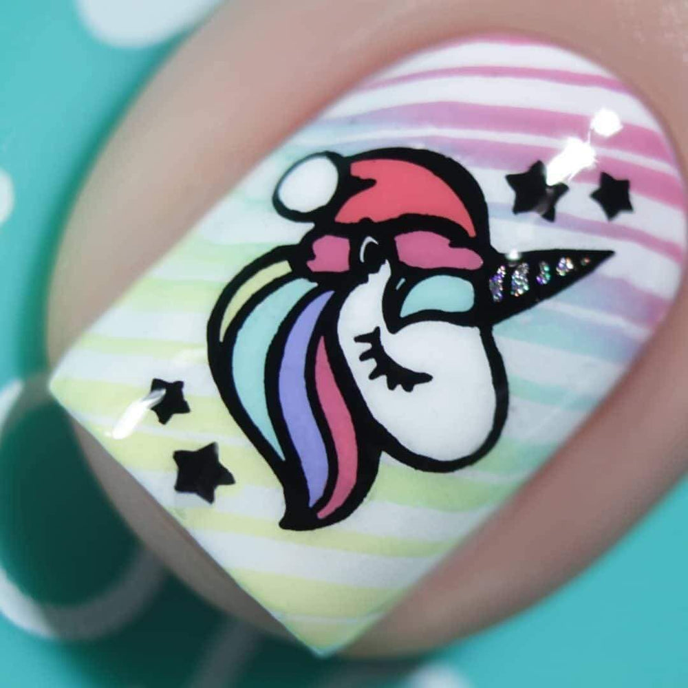 A manicured hand in a colorful polish with unicorn and stars by Maniology (m039).