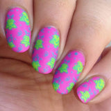 A manicured hand made with Jingle Bell Rock Collection by Maniology.