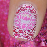A manicured hand in pink and red in a buffet-style design.
