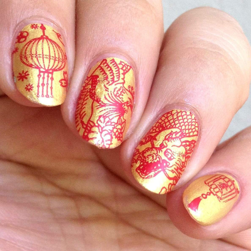 A manicured hand with Lunar New Year Occasions: Prosperity designs by Maniology (m043).
