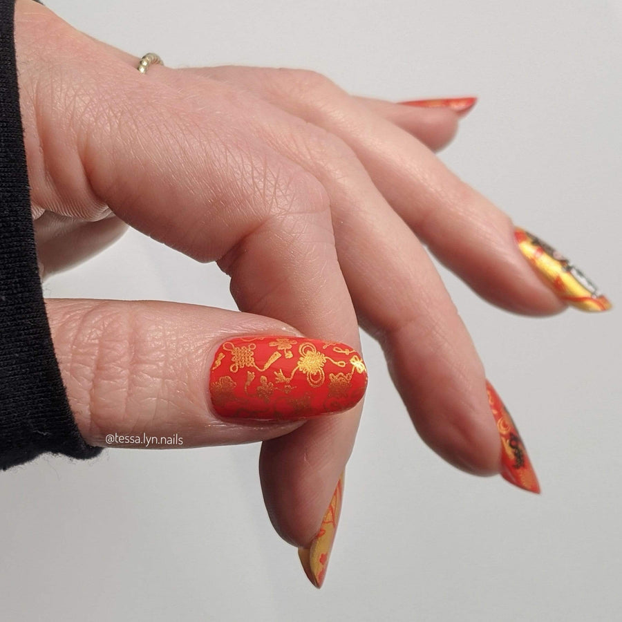 A manicured hand with Lunar New Year: Year of the Ox designs by Maniology (m185)