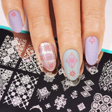 A manicured hand made with Shangri La (B296) Dusty Blue Stamping Polish by Maniology.