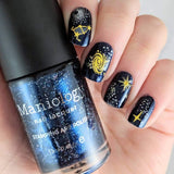 A manicured hand holding a Dark Navy Shimmer Stamping Polish by Maniology (B239).