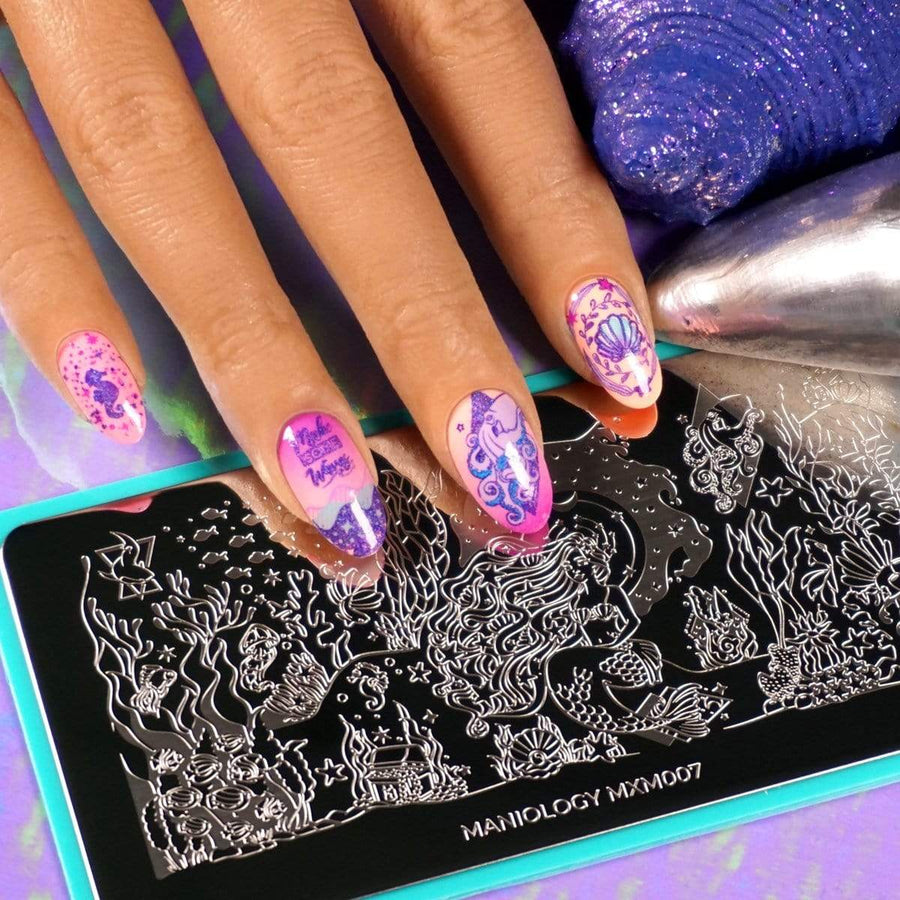 A manicured hand made with neon pink and purple stamping polishes from Maniology.