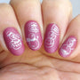 A manicured hand made with Sugarplum (B317) rosy mauve stamping polish by Maniology.