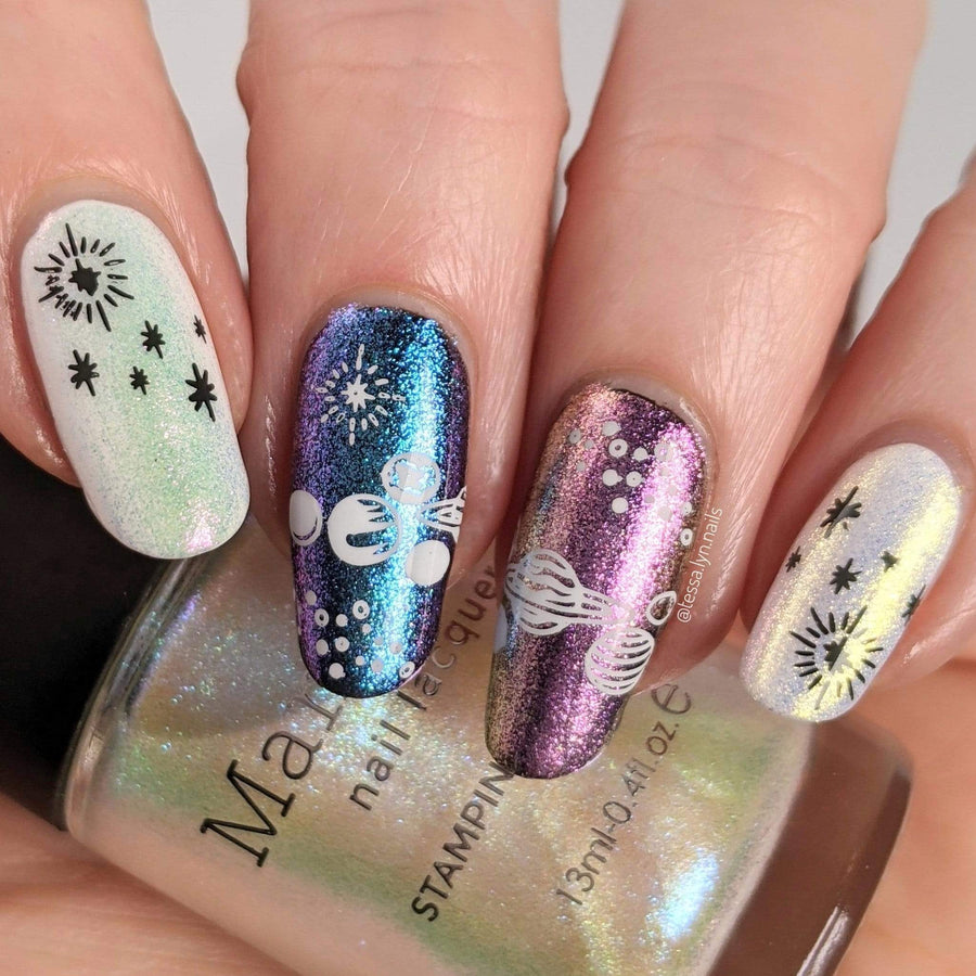 A manicured hand made with Moonbeams and holding a stamping polish Curious Matter by Maniology (B165).