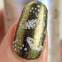 A manicured hand made with Moonbeams stamping polish by Maniology (B165).