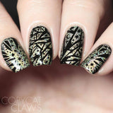  A manicured hand in black and gold with Negative Space: The Crack in Space designs by Maniology (m025).