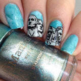 A manicured hand with mount rushmore design holding a stamping polish by Maniology.