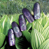 Beautiful dark manicure made with Maniology's Delirium stamping polish.