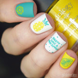 A manicured hand with Pineapple Whip: Party Like a Pineapple designs holding a yellow polish by Maniology (m051).