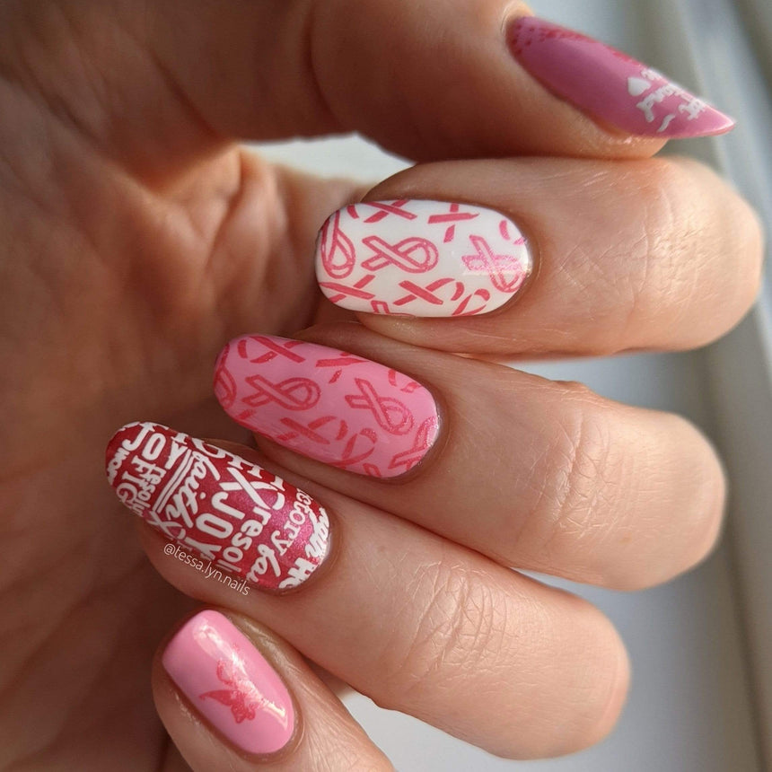 A manicured hand with Ribbons of Hope designs by Maniology (m153).