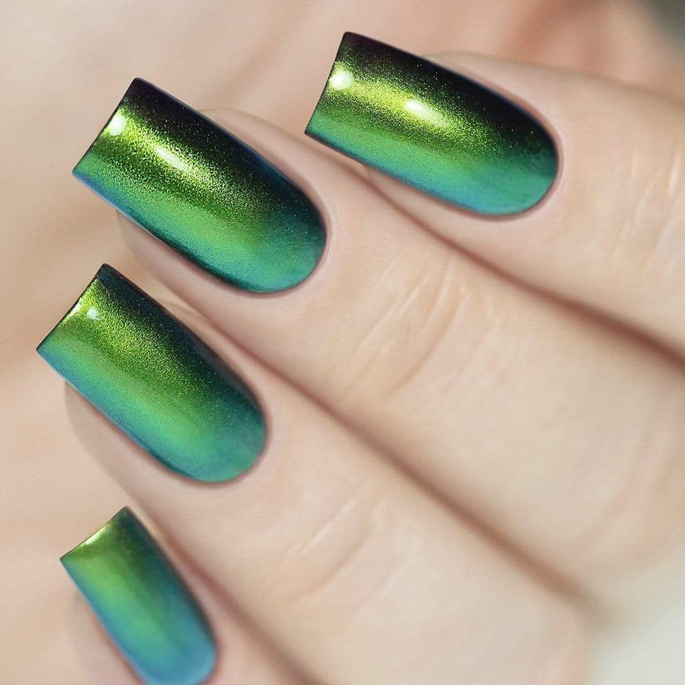 A manicured hand made with Scarab Wings Golden Green Duochrome Nail Art Powder by Maniology.