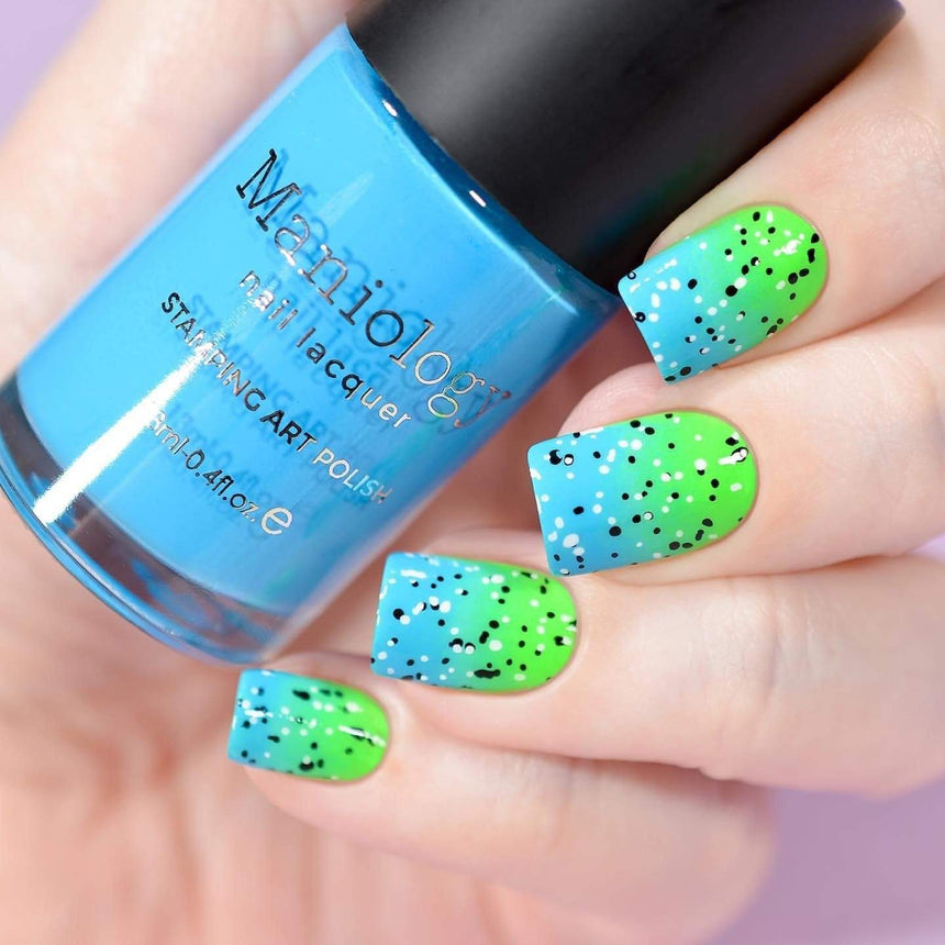 A manicured hand holding Neon Blue Stamping Polish from School's Outcollection Blue Glue (B288).
