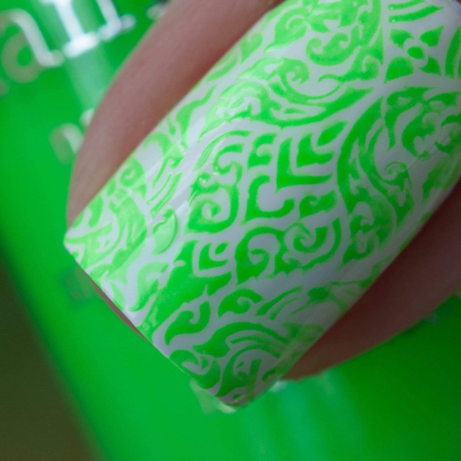A manicured hand made with Neon Green Stamping Polish from School's Out collection Food Fight (B287).