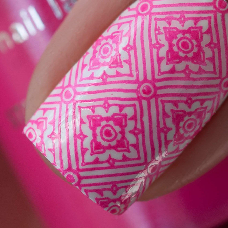 A manicured hand made with Neon Pink Stamping Polish from School's Out collection Slam Book (B290).