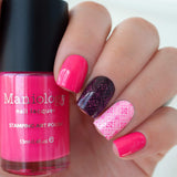 A manicured hand holding Neon Pink Stamping Polish from School's Out collection Slam Book (B290).