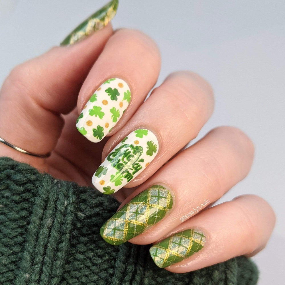 A manicured hand with clovers design by Maniology (m188).
