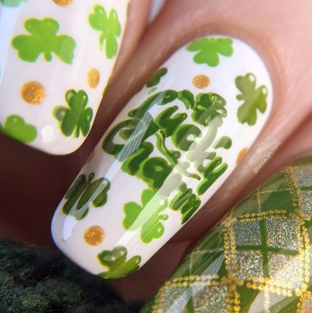 A manicured hand with clovers design by Maniology (m188).