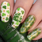 A manicured hand with clovers design holding a stamping polish by Maniology (m188).