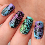 A manicured hand with coral reef, seahorse and tropical fish designs by Maniology (m146.)