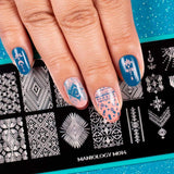 A manicured hand with stamping plate m014 designs.