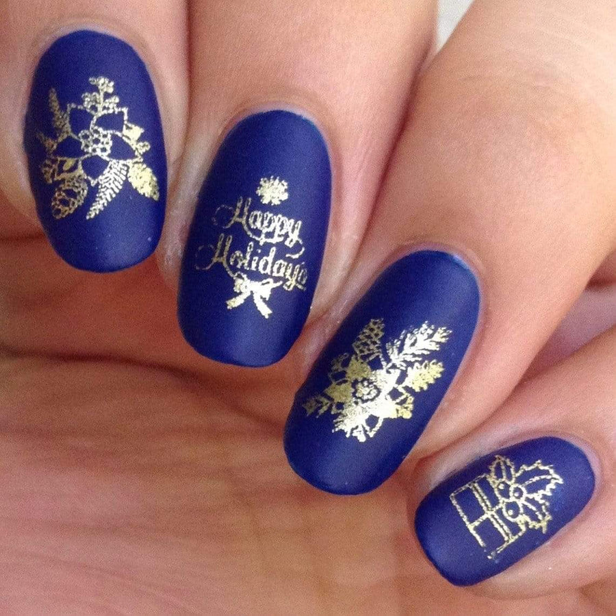 A manicured hand in blue with Holiday Trim designs by Maniology (m041).